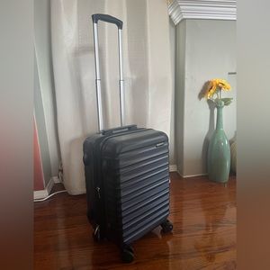 Brand new black 20” carry-on luggage